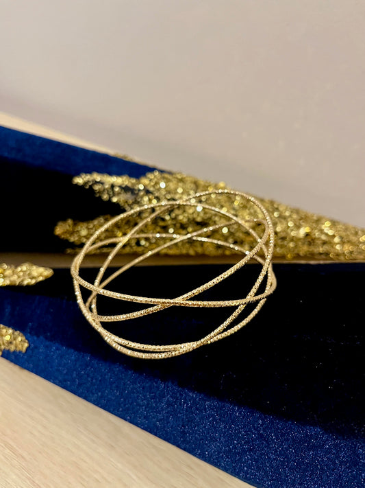 Manchette croisée dorée